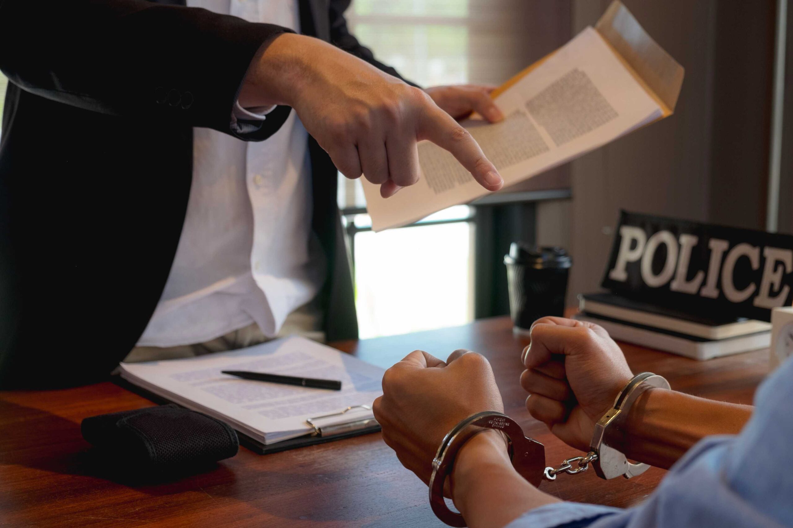 midsection-police-pointing-criminal-police-station (1) domestic violence bail bonds near glendale ca